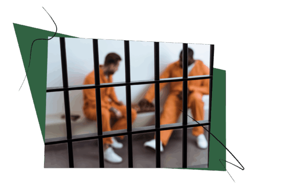 two men dressed in orange prison jumpsuits, behind bars