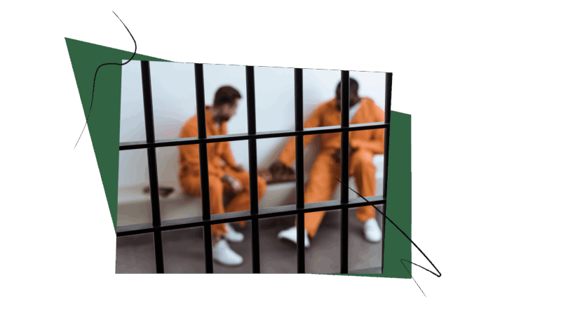 two men dressed in orange prison jumpsuits, behind bars