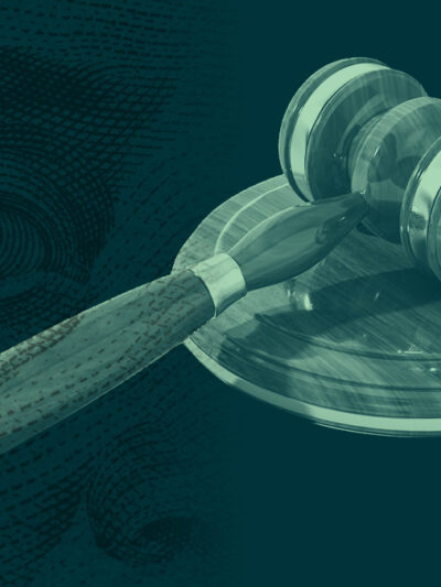 Money overlaid on a gavel