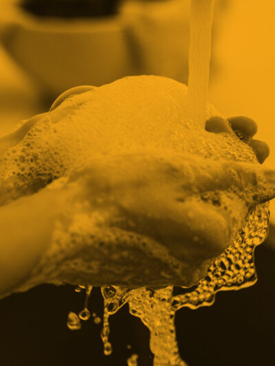 Generic_PersonWashingHands-BlackOrange_1200-675.jpg