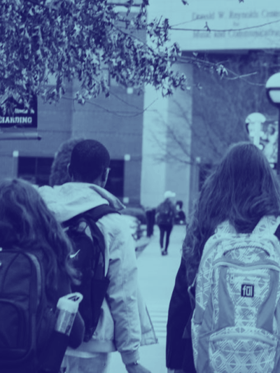 StudentsWalkingToSchoolWearingBackpacks_1200-675.png