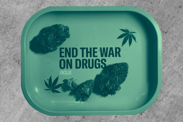 Cannabis buds on a tray that reads end the war on drugs with a green color overlay