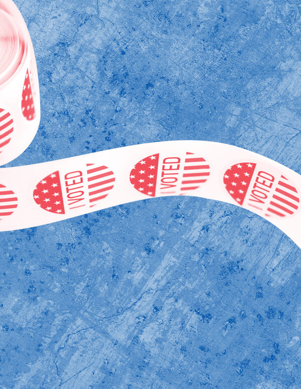 Spool of 'I Voted' stickers with a red and white color overlay on a textured blue background