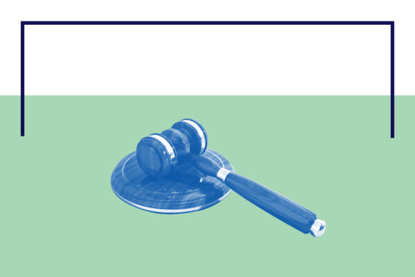 Gavel laying on its side with a blue and white color overlay on a green and white background