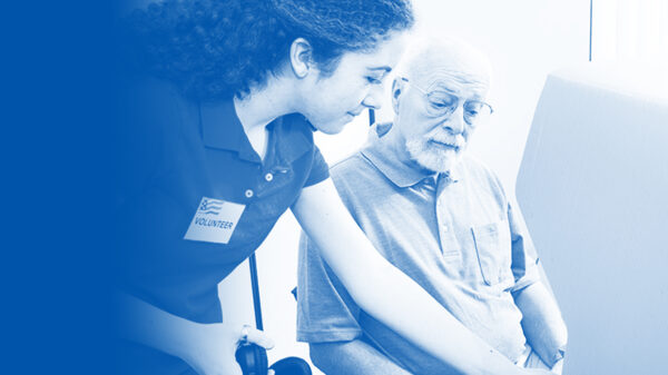 Volunteer assisting a voter with a blue and white color overlay