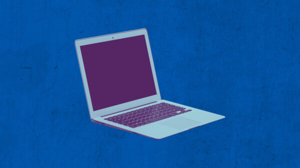 Laptop with a purple and azure color overlay on a textured blue background