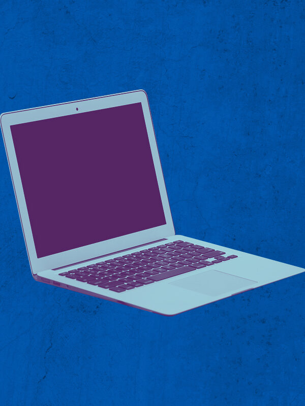 Laptop with a purple and azure color overlay on a textured blue background