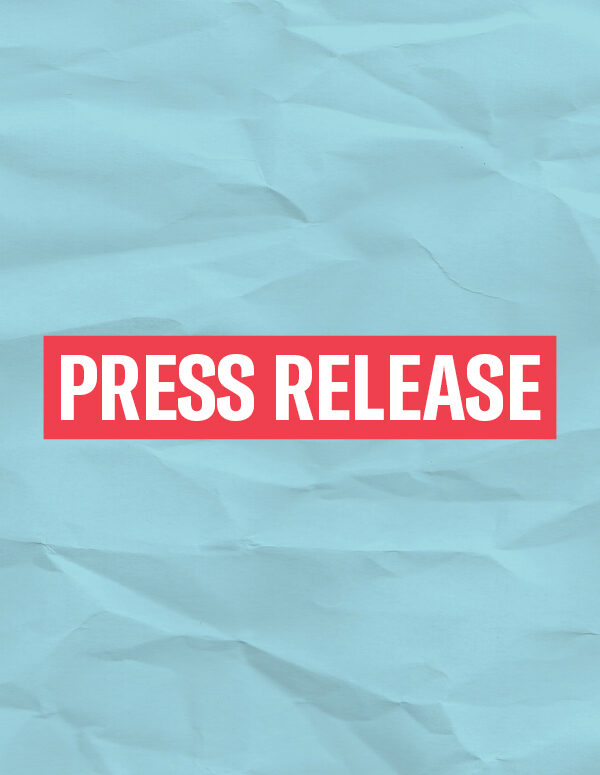 The words 'Press Release' in white font on a red rectangle on an azure paper texture background