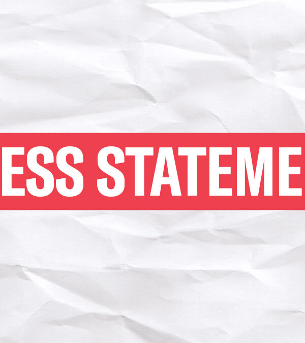 The words 'Press Statement' in white font in a red rectangle on a wrinkled white paper background