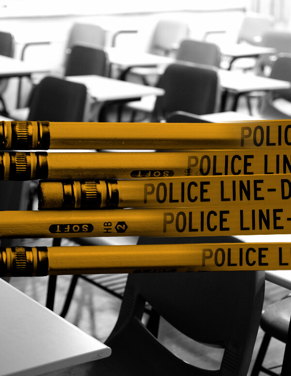 Graphic of yellow pencils combined with police tape stating "Police Line Do Not Cross." Pencils are in front of a black and white photo of a classroom with empty desks.