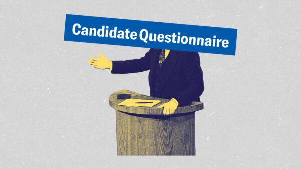 A politician at a podium with the words “Candidate Questionnaire” in white letters in a blue rectangle covering the politician’s head