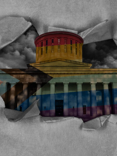 Ohio Statehouse with a pride flag overlay, with dark clouds in the sky, and tearing through paper