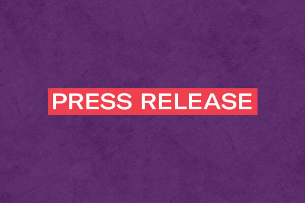 The words 'Press Release' in white letters in a red rectangle on a textured purple background
