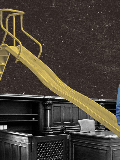 Kid facing the interior of a courtroom with a yellow slide placed over the table