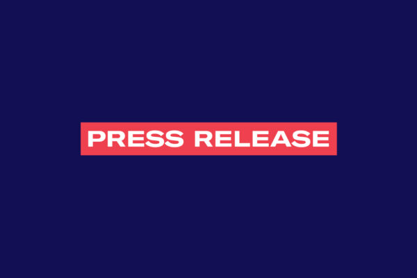 The words 'Press Release' in white font in a red rectangle on a navy background