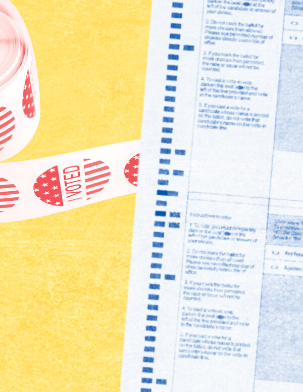 blurred ballot with roll of red I voted stickers