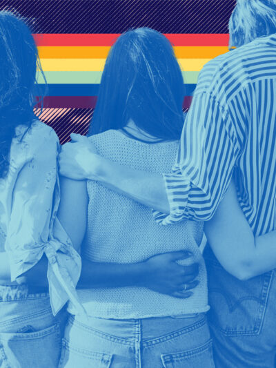 Image of three young people with their arms around each other and an LGBTQ+ pride flag in the background