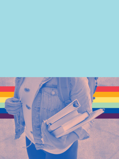 student holding books with pride flag in the background