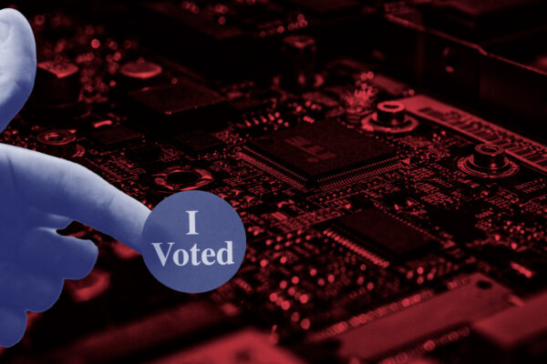 Red electronic background with a hand holding an "I Voted" sticker