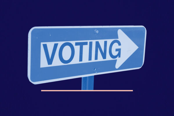 Blue and white 'voting' sign on a navy background