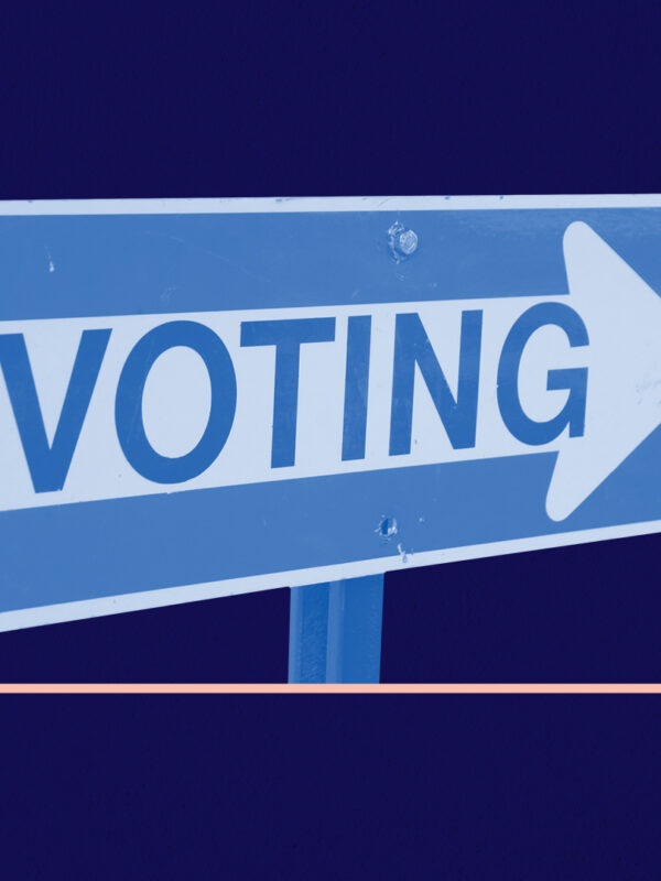 Blue and white 'voting' sign on a navy background