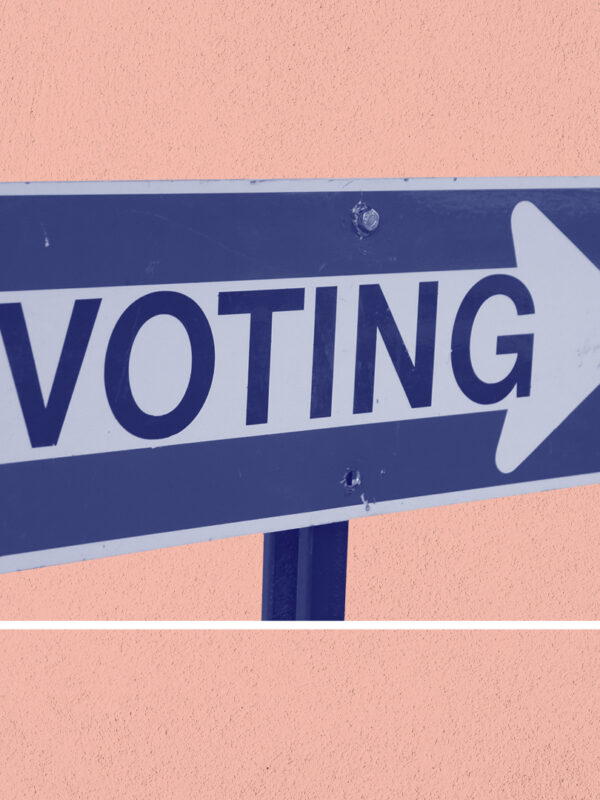 Blue and white 'voting' sign on a navy background
