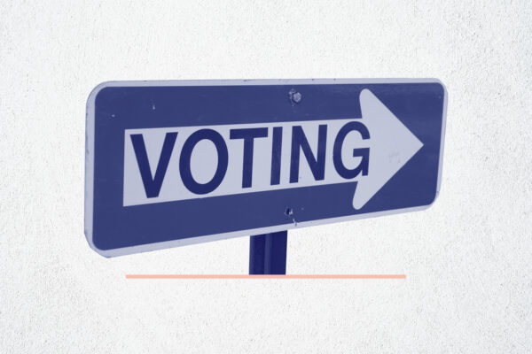Navy and white 'voting' sign on a white background