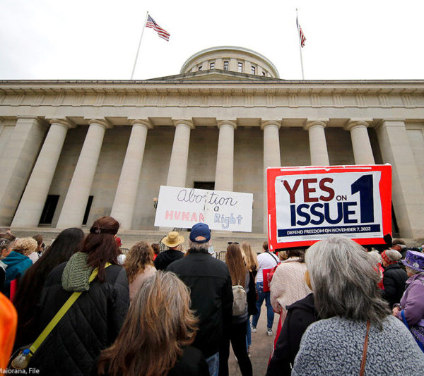 statehouse with yes on issue 1 sign