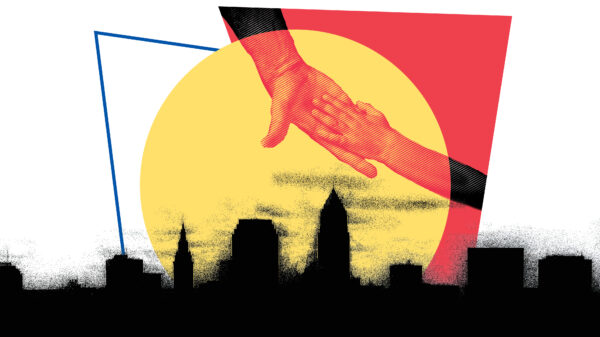 Hands reaching for each other over Cleveland skyline