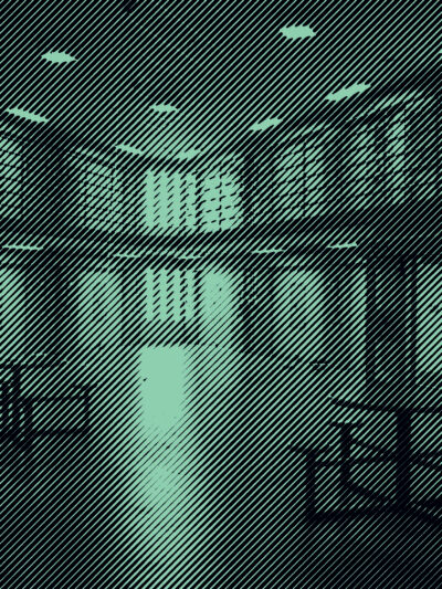 Grainy Green and Black Photo of prison interior