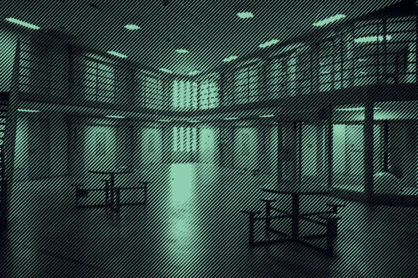 Grainy Green and Black Photo of prison interior