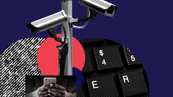 Photograph a video camera, a keyboard, hands holding a smart phone, mixed with red, white, and blue graphics