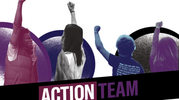 Protestors with hands reaching up