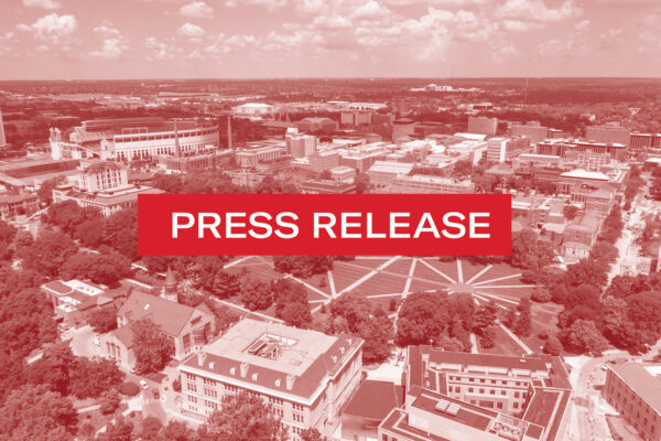 OSU oval in red with press release in white letters