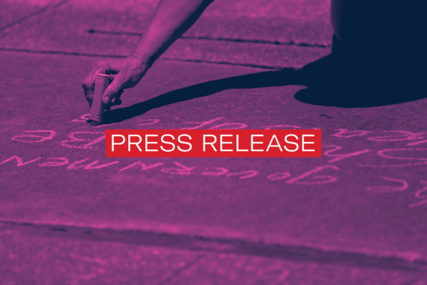 Background of someone writing with chalk with the words Press Release