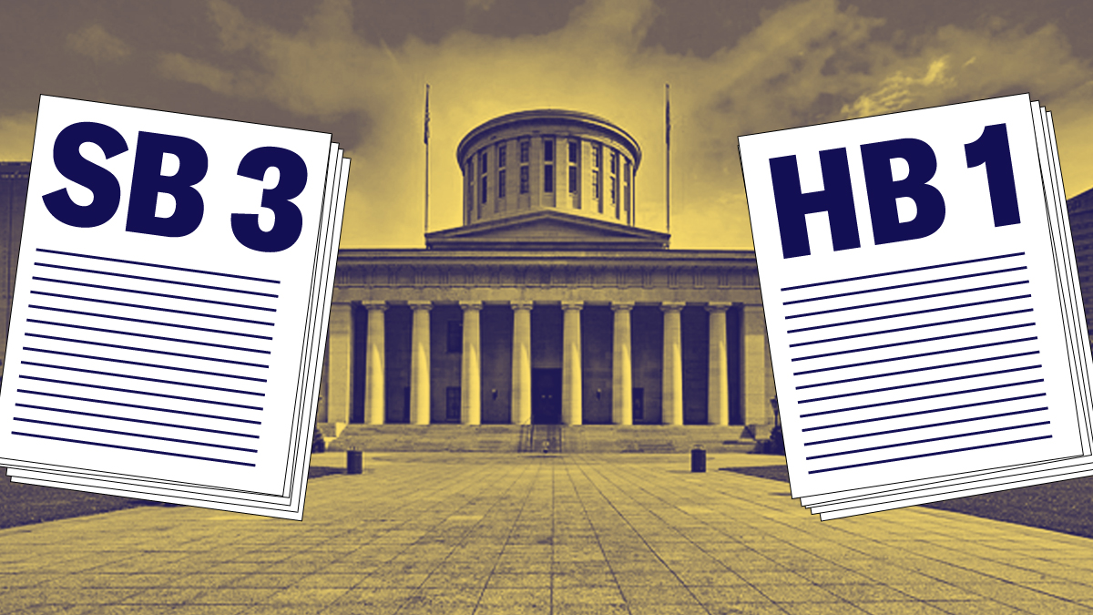 SB3 and HB1 stacks of paper, in front of the Ohio Statehouse