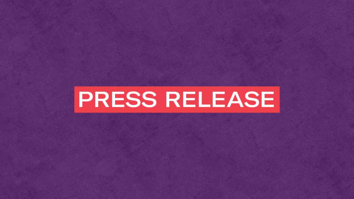 The words 'Press Release' in white letters in a red rectangle on a textured purple background