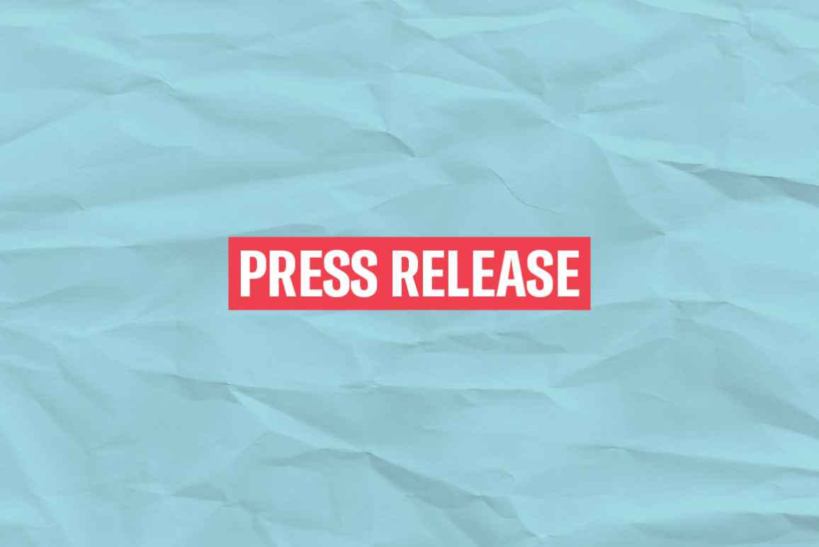 The words 'Press Release' in white font on a red rectangle on an azure paper texture background