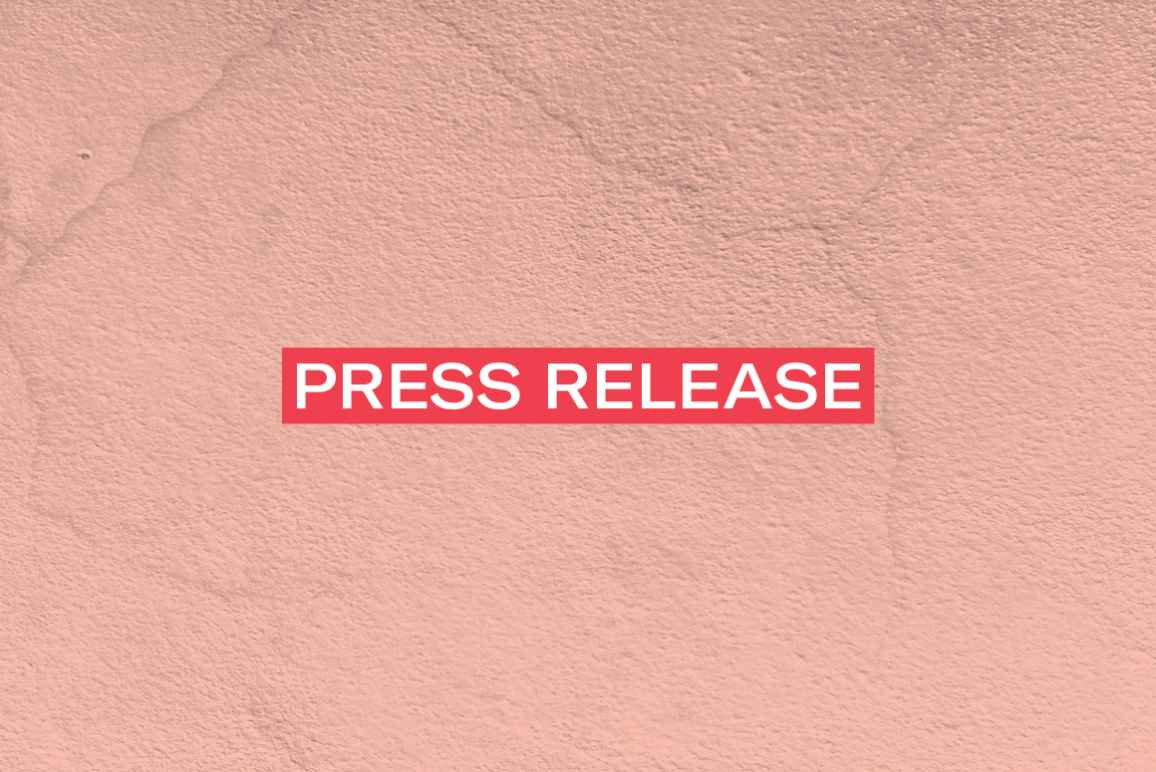 The words 'Press Release' in white font on a red rectangle on an pink concrete texture background