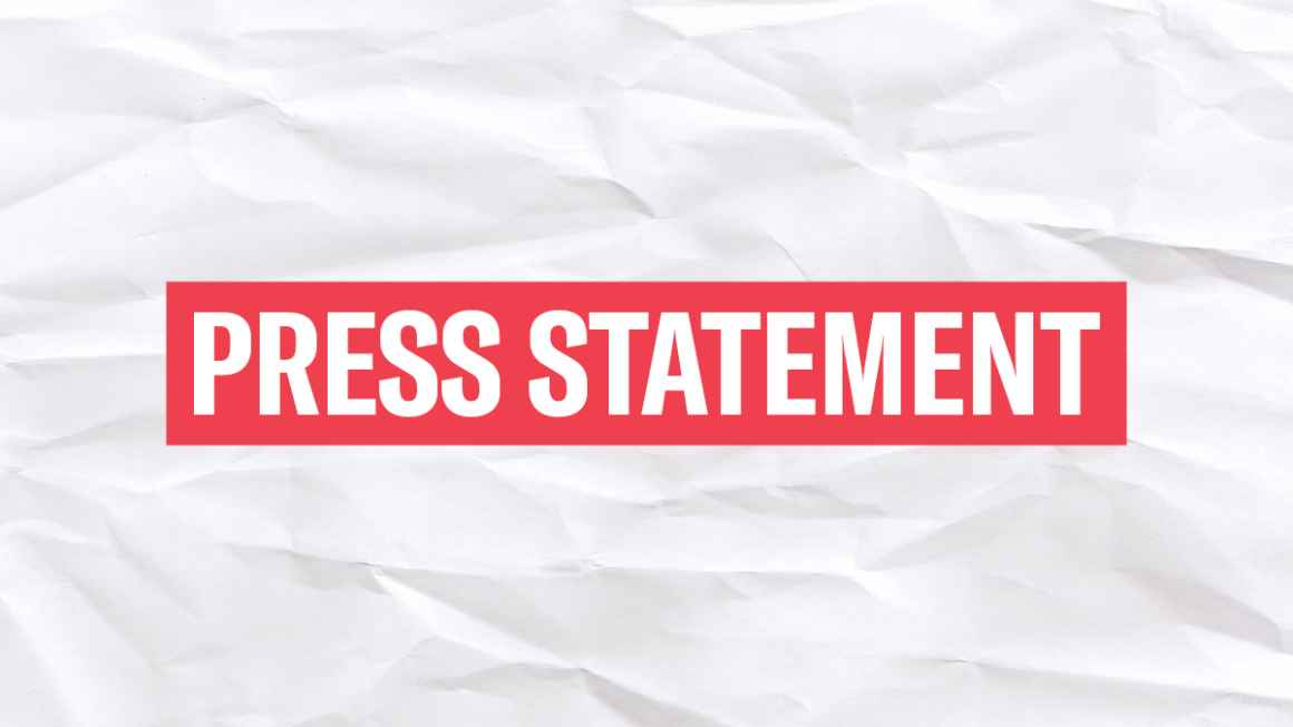 The words 'Press Statement' in white font in a red rectangle on a wrinkled white paper background