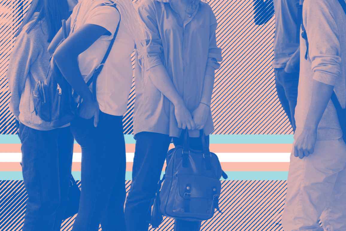 A group of young people standing with backpacks with a trans flag behind thir legs