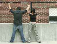 Boy and girl at school fence