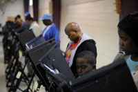 Voters using voting machines