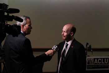 Mike Brickner speaking with reporters