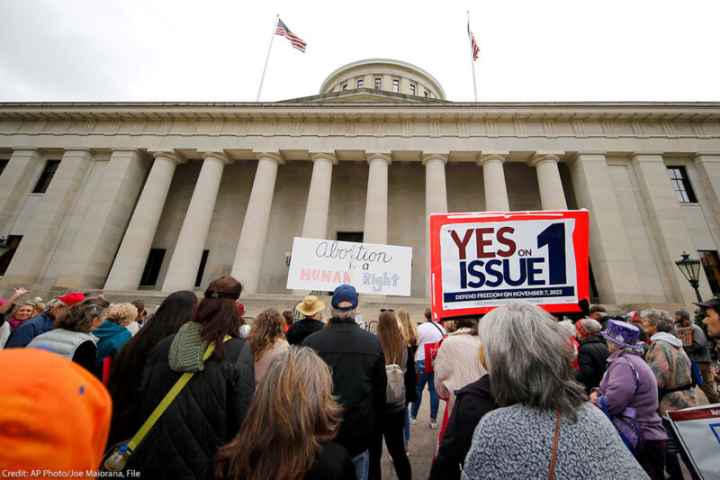 statehouse with yes on issue 1 sign