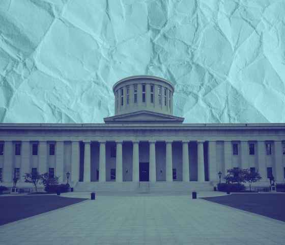 The Ohio Statehouse with a navy color overlay, on a paper textured azure background